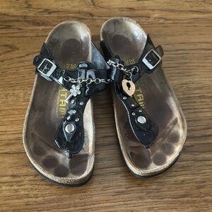 Birkenstock Tatami Black Sandals with lock and key charm detail